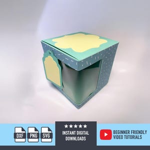May include: A teal paper gift box with a yellow cloud-shaped accent on the top and a matching tag. The box has a window and is decorated with small white dashes. The bottom of the image has icons for file types and text that reads "Instant Digital Downloads" and "Beginner Friendly Video Tutorials."