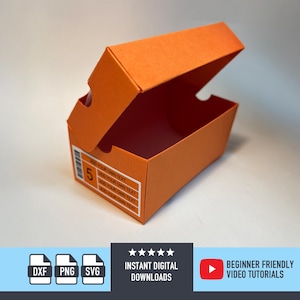 May include: An open orange shoe box made of paper. The box has a lid that is partially open, revealing the interior. The box has a label with the number 5 and text that says "ADD YOUR OWN TEXT".
