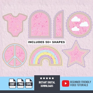 Puede incluir: Colección de formas digitales rosas con contornos dorados y morados, incluyendo un body, un arco, un círculo con nubes, un símbolo de la paz, un arcoíris y una estrella. El texto "INCLUDES 50+ SHAPES" es visible. Iconos de archivos DXF, PNG y SVG.