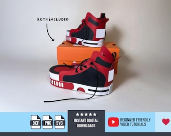 May include: Two red, black, and white high-top trainers are displayed, one atop an orange box, the other in front. The trainers have black laces and a white sole. The text "BOTH INCLUDED" is above the trainers. Below are icons and text.