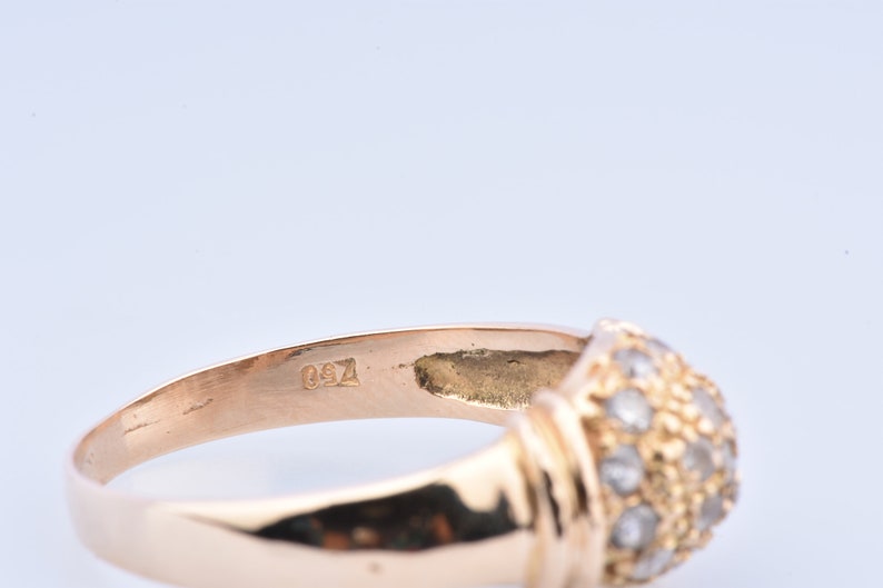 embellished with zirconium. 750 thousandths 18-carat yellow gold ring