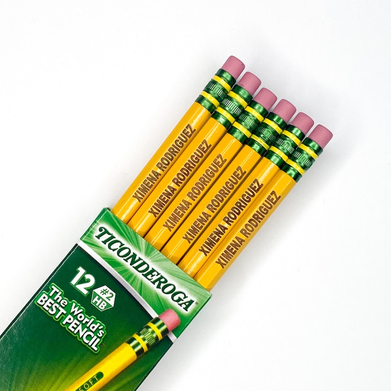 May include: A pack of 12 yellow pencils with green and black accents. The pencils are labelled "Ticonderoga" and "The World's Best Pencil". Each pencil has a pink eraser and is personalised with the name "Ximena Rodriguez".