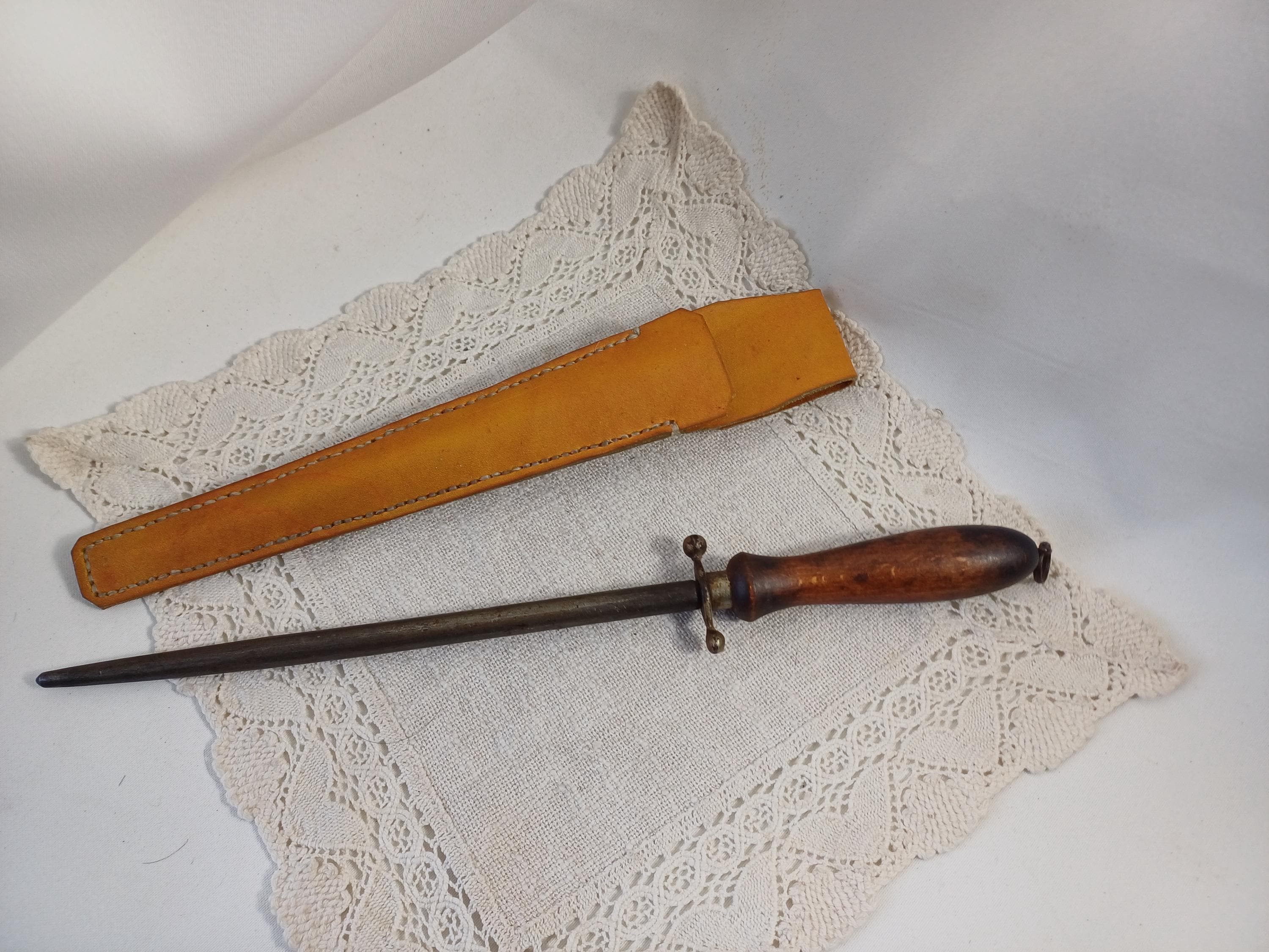 Vintage sharpening steel with hand-stitched leather case
