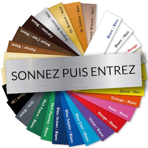 May include: A circular color chart with various color options for a door sign. The sign reads "SONNEZ PUIS ENTREZ" in black text on a silver background. Each color option is labeled with a color name and a slash followed by "Blanc" or "Noir".