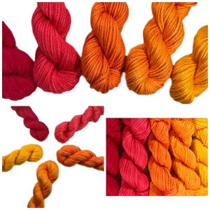 May include: A set of four skeins of yarn in shades of red, orange, and yellow. The yarn is a gradient from red to yellow.