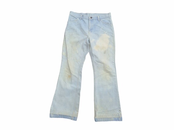 white distressed flare jeans