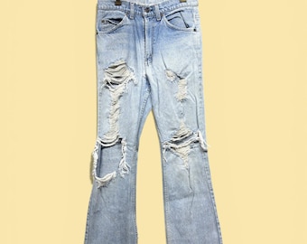 Vintage Levi's Distressed 80s Boot Cut Flared Jeans Size 28