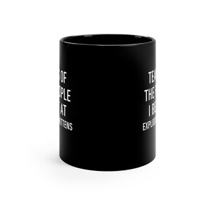 a black coffee mug with white lettering on it
