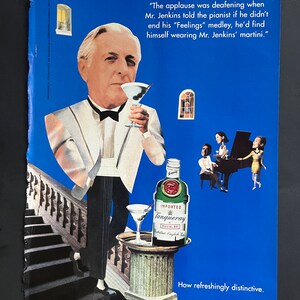 May include: A man in a white tuxedo holds a martini glass. The text "The applause was deafening when Mr. Jenkins told the pianist if he didn't end his "Feelings" medley, he'd find himself wearing Mr. Jenkins' martini." is above the man. A bottle of Tanqueray gin is on a pedestal with a martini glass. The text "IMPORTED Tanqueray SPECIAL DRY" is on the bottle. The text "How refreshingly distinctive." is at the bottom of the image.