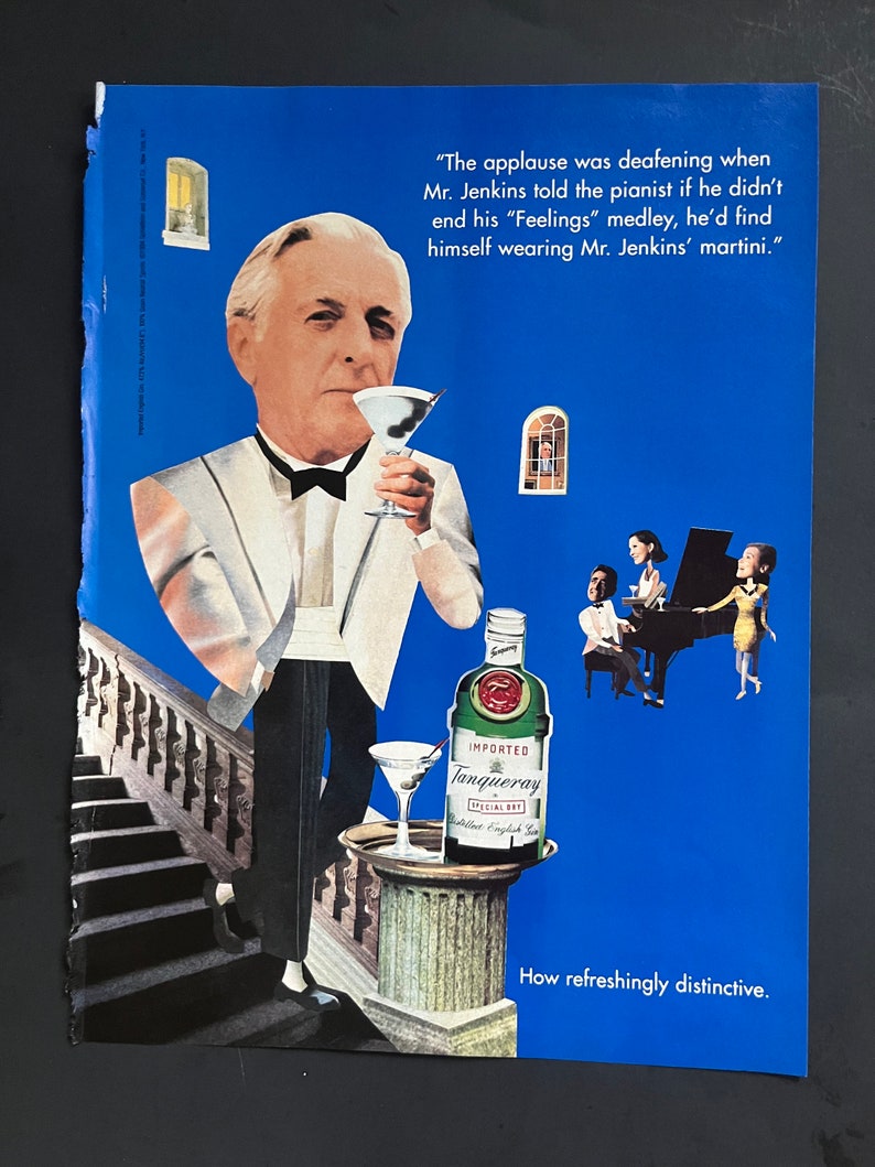 May include: A man in a white tuxedo holds a martini glass. The text "The applause was deafening when Mr. Jenkins told the pianist if he didn't end his "Feelings" medley, he'd find himself wearing Mr. Jenkins' martini." is above the man. A bottle of Tanqueray gin is on a pedestal with a martini glass. The text "IMPORTED Tanqueray SPECIAL DRY" is on the bottle. The text "How refreshingly distinctive." is at the bottom of the image.