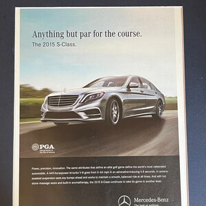May include: A silver Mercedes-Benz S-Class sedan driving on a race track. The car has the text "Anything but par for the course. The 2015 S-Class." above it and the text "Mercedes-Benz The best or nothing." below it.