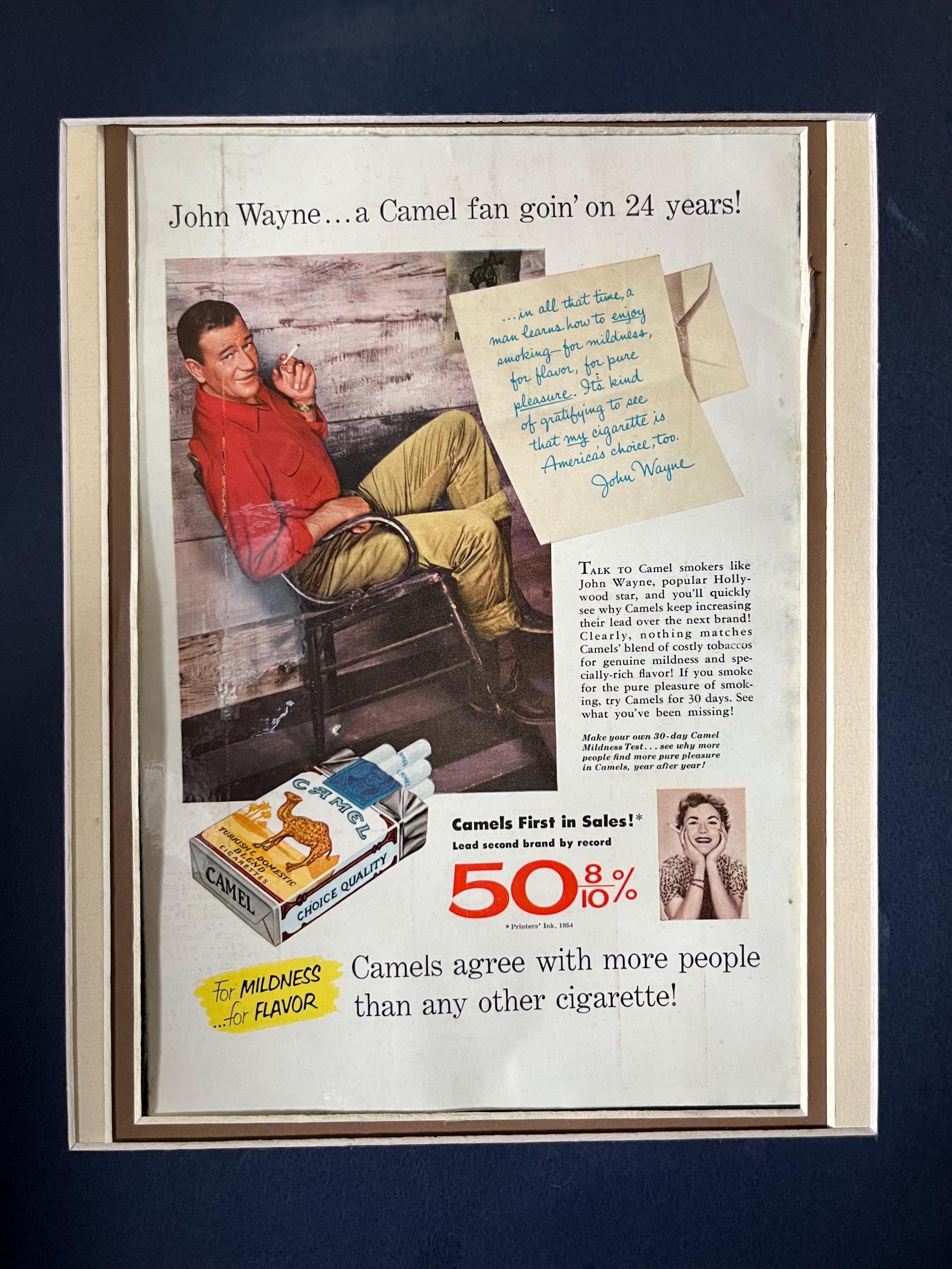 cigarette brands wayne 1950's John Wayne Camel Cigarette Laminated Printed Advertisement