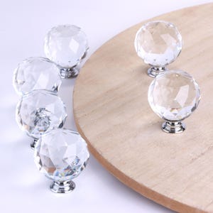 May include: A trio of ceramic mugs with a speckled, matte finish in blue, green, and white. Each mug has a rounded handle and a simple, modern design. Ideal for tea or coffee.