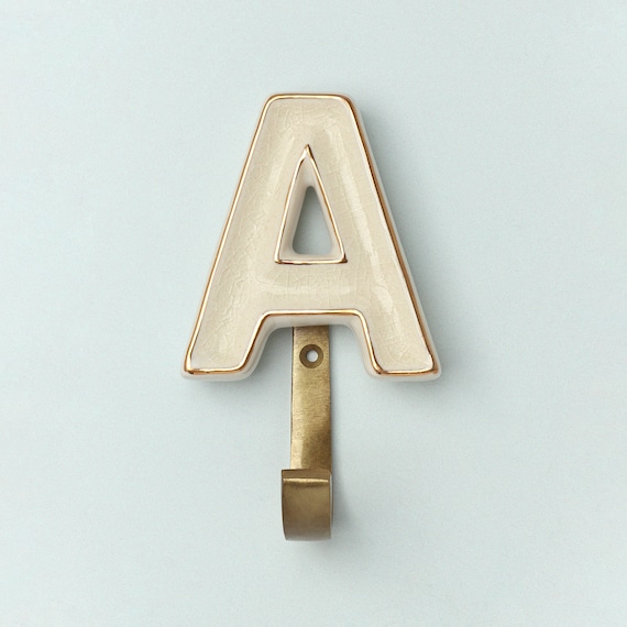 G Decor Alphabet Cream Crackle Glazed Hooks in Antique Brass Coat
