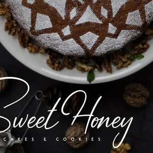 May include: A close-up of a round cake with a decorative design on top, dusted with powdered sugar. The cake is surrounded by walnuts and is on a white plate. The text "Sweet Honey Cakes & Cookies" is written in white cursive on a black background.