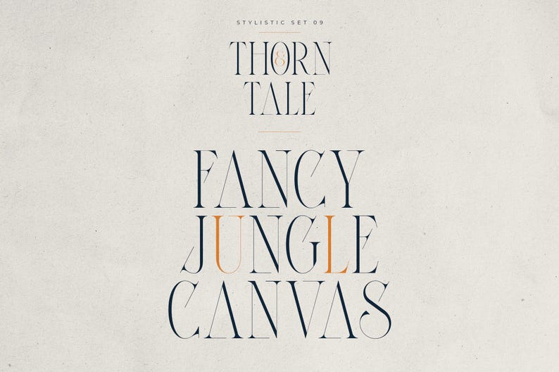 May include: A stylized graphic design featuring the words "THORN & TALE" and "FANCY JUNGLE CANVAS" in a serif font. The text is in navy blue and orange on a cream-colored background. The words are arranged in a stacked format.