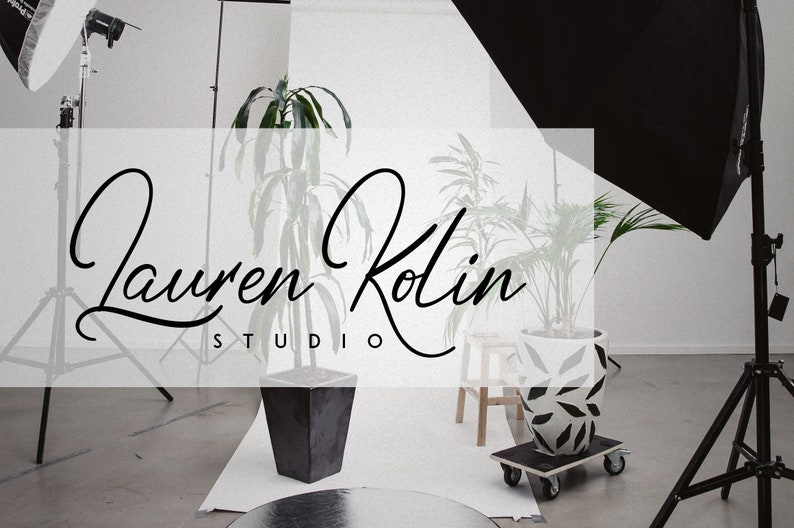 May include: A studio photography setup with two plants in pots and a white backdrop. The text "Lauren Kolin Studio" is displayed in a black cursive font.