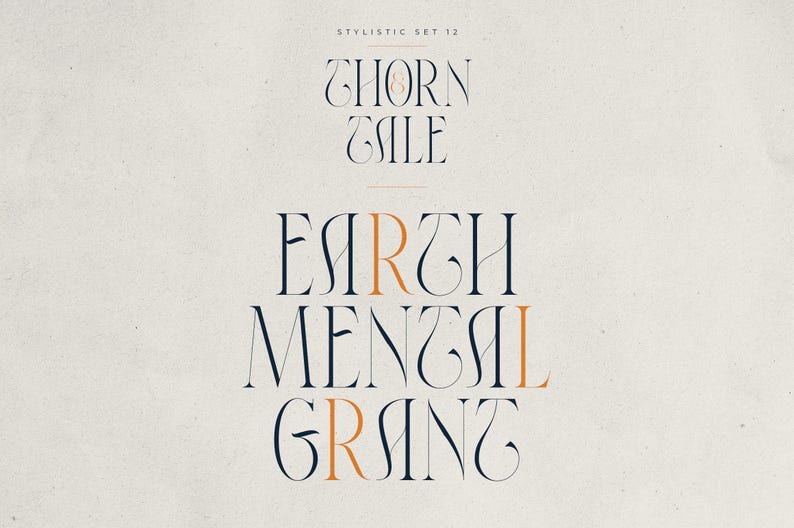 May include: A stylized graphic design featuring the words "THORN TALE" and "EARTH MENTAL GRANT" in a decorative serif font. The text is in a dark navy blue color with accents of orange, set against a cream-colored background. The words are arranged vertically.
