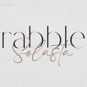 May include: A graphic design featuring the text "rabble" in a bold, sans-serif font and "solasta" in a cursive script font. The text is in black and brown on a white background.
