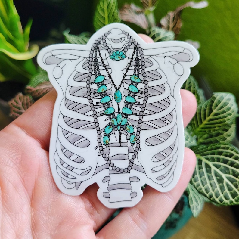 May include: A sticker of a ribcage with a turquoise and silver necklace with turquoise stones. The necklace is in the shape of a teardrop.