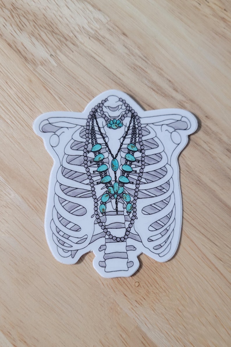 May include: A white sticker with a line drawing of a ribcage with a turquoise and silver necklace inside.