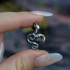 snake earrings
snake jewelry
stud earrings
gothic earrings
animal earrings
goth earrings
silver stud earrings
witchy jewelry
gothic jewelry
nature jewelry
sterling silver
screw back earrings
unique earrings