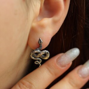 snake earrings
snake jewelry
stud earrings
gothic earrings
animal earrings
goth earrings
silver stud earrings
witchy jewelry
gothic jewelry
nature jewelry
sterling silver
screw back earrings
unique earrings