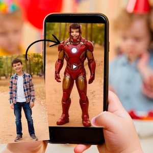 May include: A child's hand holding a smartphone displaying an image of a boy in an Iron Man costume. The costume is red and gold with a glowing chest piece. A photo of the boy in casual clothes is also visible.