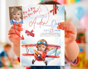 May include: A blue and red airplane birthday invitation with a photo of a child in a pilot's hat. The invitation says "My oh My, How Time Flies!" and "Aiden is turning One". The date is July 23rd at 2:00 PM.