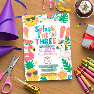 May include: A vibrant birthday invitation with the words "Splash into THREE" and illustrations of summer elements. The image includes a cupcake, gift, crayons, party hats, and scissors. The invitation is for Alissa's 3rd birthday.