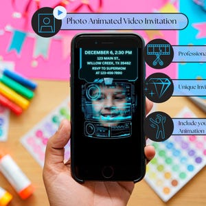 May include: A black smartphone displays a photo animated video invitation. The screen shows a child's face with event details: date, time, address, and RSVP information. Additional text highlights features: professionally edited, unique invitations, and animation.