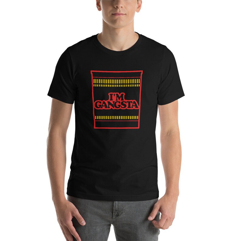 May include: A black t-shirt with a red and yellow graphic of a ramen noodle cup with the text "I'M GANGSTA" printed on it.