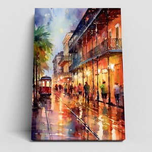 The image is a vibrant painting depicting a lively street scene in New Orleans, Louisiana. The painting showcases the iconic trolley car and the bustling atmosphere of the city, with people walking along the sidewalks and the trolley car passing through the center of the scene. The colors used in the painting are bright and vivid, reflecting the energy and excitement of the city.