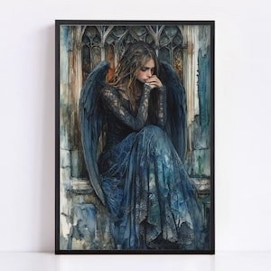 May include: A framed watercolor print of a woman with long hair and large blue wings, dressed in a long blue gown. The woman is seated, with her hands clasped near her face. The background features architectural details in shades of blue and brown.