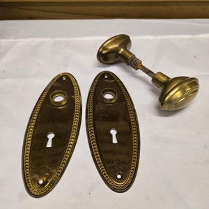 May include: A set of three ceramic mugs with a speckled, matte finish. The mugs are in shades of cream, light gray, and dark gray. Each mug has a simple, minimalist design, perfect for coffee or tea.