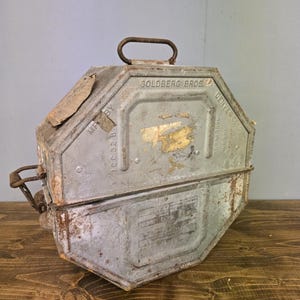 Vintage Goldberg Brothers Cinema Metal Movie Film Reel Case Canister Planet Dinosaur (empty)