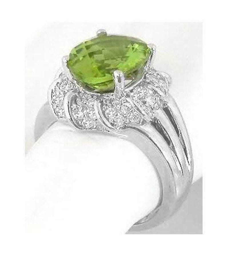 Diamond Encrusted Halo Style Peridot Ring with Triple Split Shank in 14k white gold