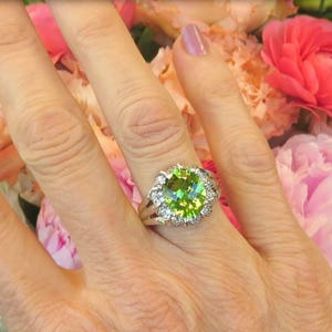 Juicy Green Peridot nearly 4 Carats in Size with 0.62 carats of Diamonds in 14k white gold