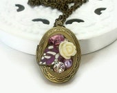 Oval photo locket with white rose