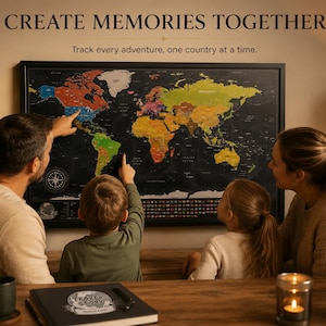 May include: A black scratch-off world map in a black frame with the text CREATE MEMORIES TOGETHER and Track every adventure, one country at a time. The map features colorful continents against a black background with a compass rose and legend.