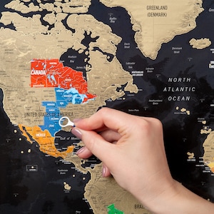 Interactive scratch-off world map featuring over 700 cities, 196 country flags, mountains, and archipelagos. Perfect for travel enthusiasts to mark visited places, create memories, use as wall decor, or give as a gift for travelers.
