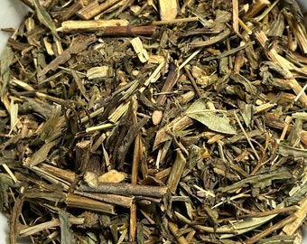 May include: A close-up of a bowl filled with dried herbs and stems. The herbs are a mix of green and brown, and the stems are mostly brown. The herbs appear to be a blend of different types of plants.