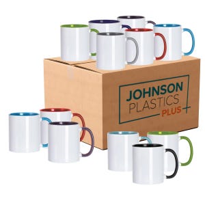 May include: A box of 12 blank white ceramic mugs with colored rims and handles. The box is brown and has the text "JOHNSON PLASTICS PLUS" printed on it.