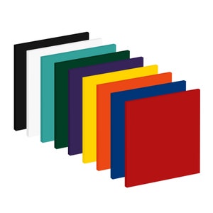 May include: A collection of ten square, solid-colored blocks arranged in a diagonal row. The blocks display a variety of colors, including black, white, teal, dark green, purple, yellow, orange, navy blue, and red. The blocks are evenly spaced and appear to be made of a solid material.