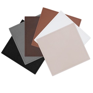 May include: A collection of square coasters in various colors, including black, gray, brown, tan, and white. Each coaster has a textured surface and a stitched border. The coasters are arranged in a fan shape, showcasing their different hues.