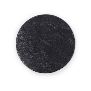 May include: A round black slate serving board, perfect for charcuterie, cheese, or appetizers.