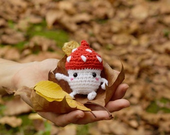 Amigurumi mushroom kawaii. Woven keychain in the shape of a mushroom.