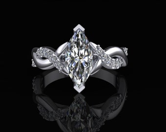 Könnte beinhalten: Ein silberner Verlobungsring mit einem Marquise-Diamanten, der in einem verdrehten Band mit kleineren Diamanten an den Seiten gefasst ist.