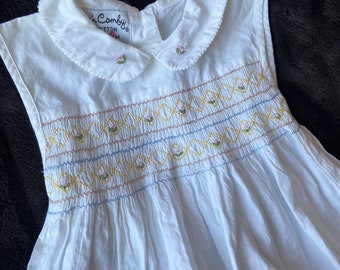 Smocked White Sleeveless Dress for Baby with Floral Embroidered Peter Pan Collar and Embroidered Flowers in Smocking