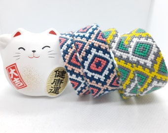 pair of DMC Brazilian bracelets, 9 and 18 strands